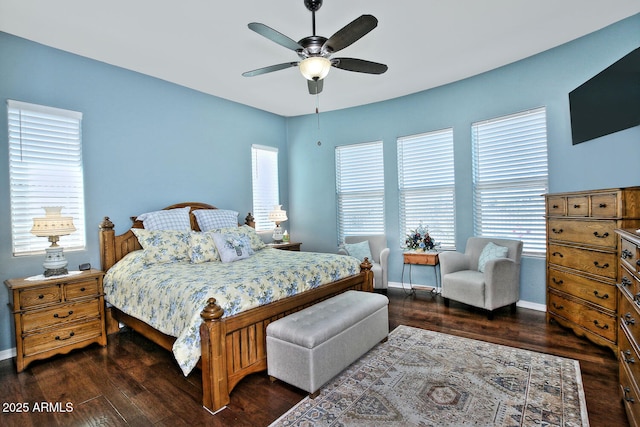 bedroom with dark hardwood / wood-style floors and ceiling fan