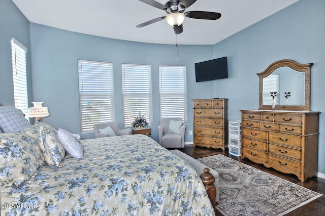 bedroom featuring ceiling fan and dark hardwood / wood-style floors