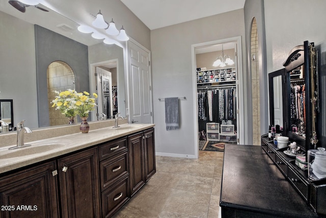 bathroom with vanity and an inviting chandelier