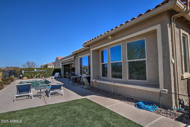 view of patio with a fenced in pool