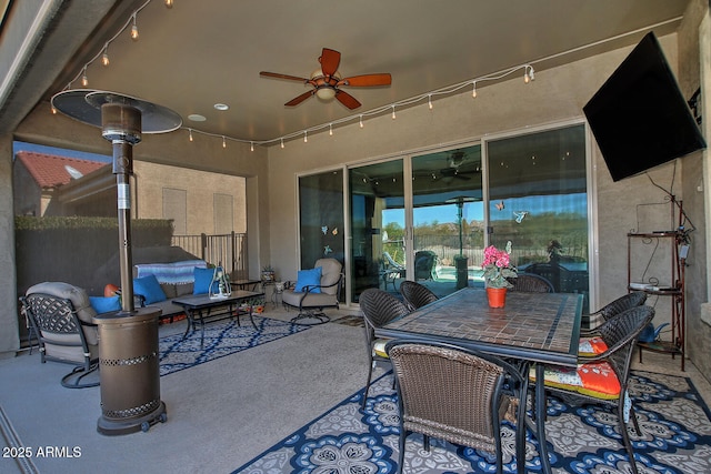 view of patio featuring ceiling fan