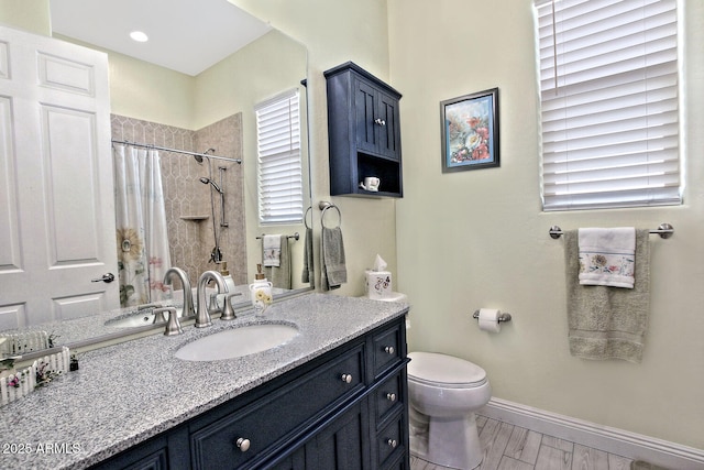 bathroom featuring hardwood / wood-style flooring, vanity, toilet, and a shower with curtain