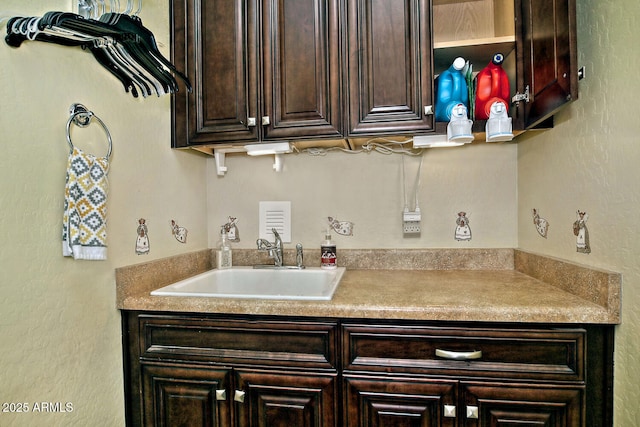 kitchen with sink and dark brown cabinetry