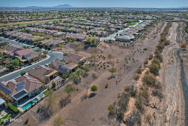 birds eye view of property featuring a mountain view