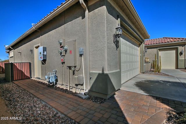 view of side of property featuring a garage