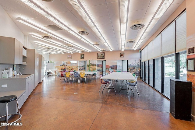 dining space with concrete floors and sink