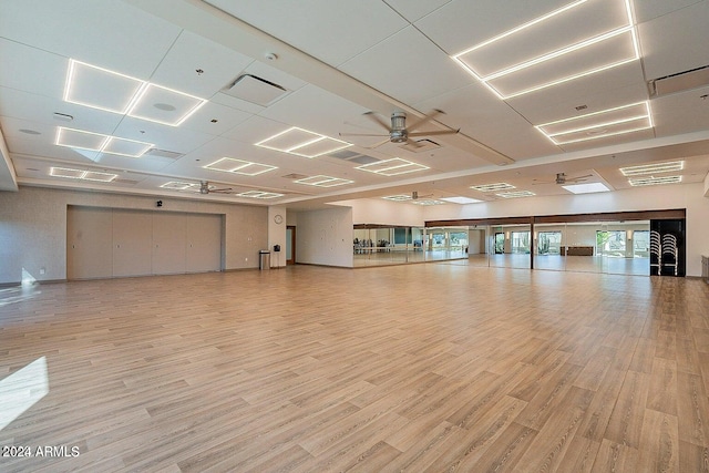 spare room with light wood-type flooring and ceiling fan