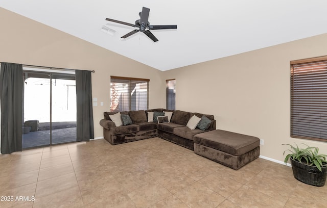 living area with ceiling fan, light tile patterned floors, visible vents, baseboards, and vaulted ceiling