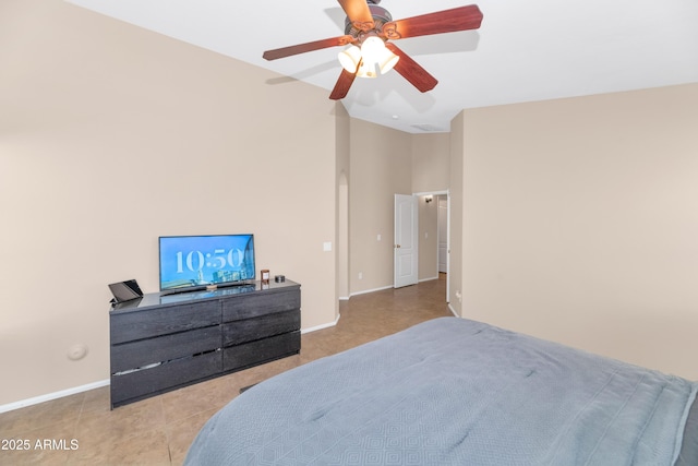 bedroom with light tile patterned floors, baseboards, and a ceiling fan