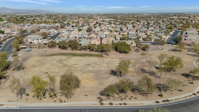 drone / aerial view featuring a residential view and a mountain view