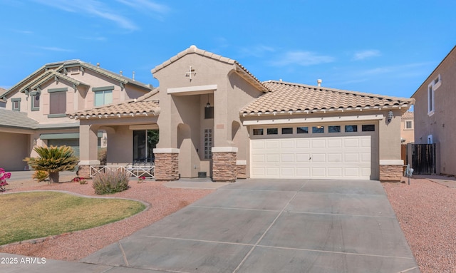 mediterranean / spanish-style home with stone siding, driveway, and stucco siding