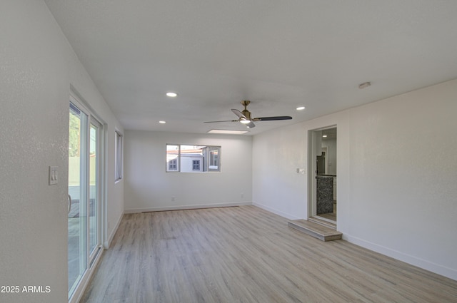 unfurnished room featuring light hardwood / wood-style floors and ceiling fan