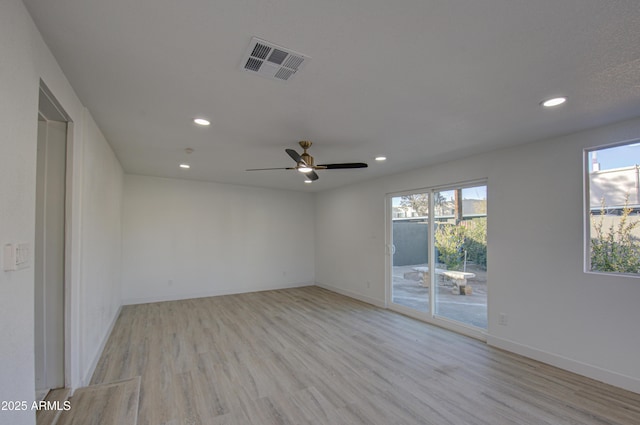 unfurnished room with ceiling fan and light hardwood / wood-style flooring