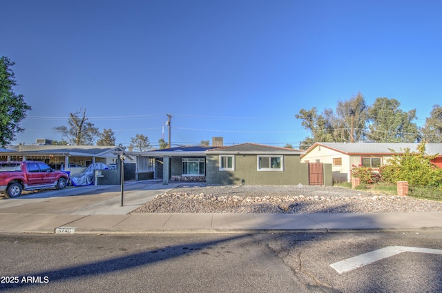 ranch-style house with a carport