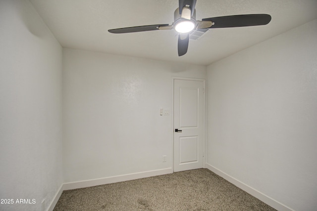 empty room with ceiling fan and carpet floors