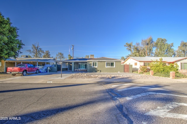 ranch-style home with a carport