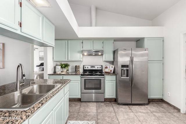 kitchen featuring appliances with stainless steel finishes, light tile patterned floors, sink, and lofted ceiling