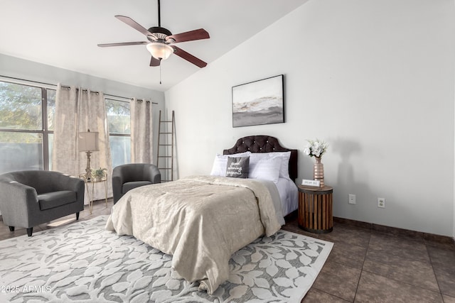 tiled bedroom featuring ceiling fan and vaulted ceiling