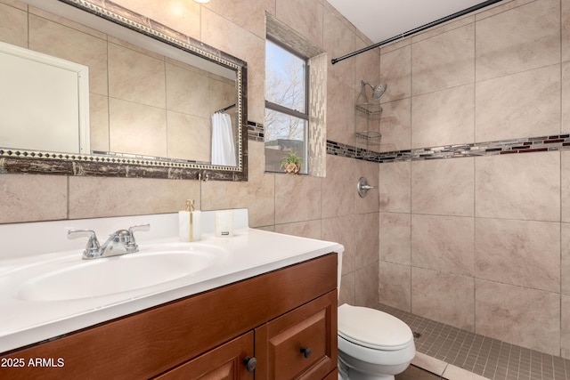 bathroom featuring toilet, a shower with curtain, tile walls, and vanity