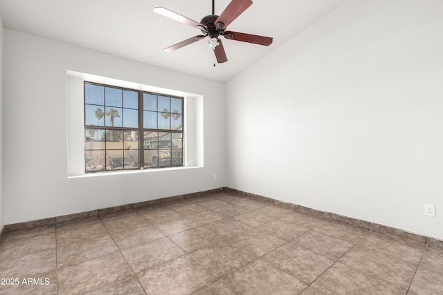 tiled spare room featuring lofted ceiling and ceiling fan