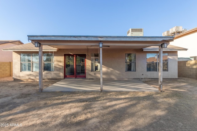 back of house with a patio and cooling unit