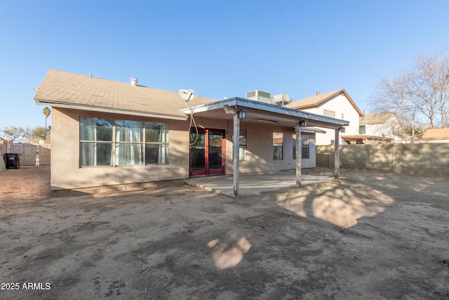 back of house with a patio