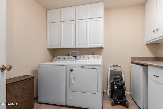 laundry room featuring cabinet space and independent washer and dryer
