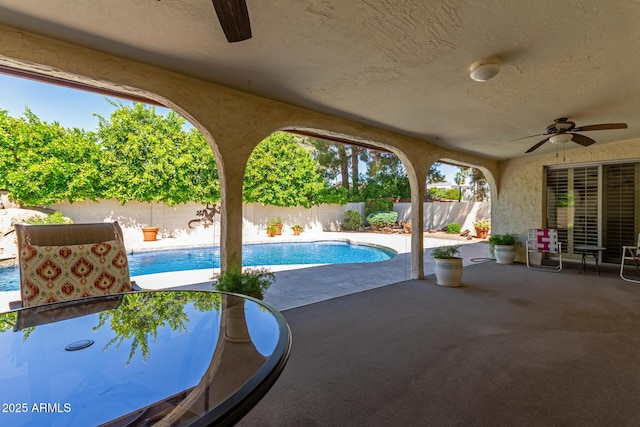 view of pool featuring ceiling fan, a fenced backyard, and a patio area