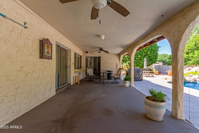 view of patio / terrace featuring a ceiling fan, fence, outdoor dining area, and a grill