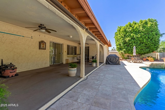 view of pool featuring a ceiling fan, a patio, and a fenced backyard