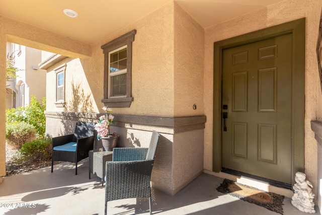 property entrance with covered porch