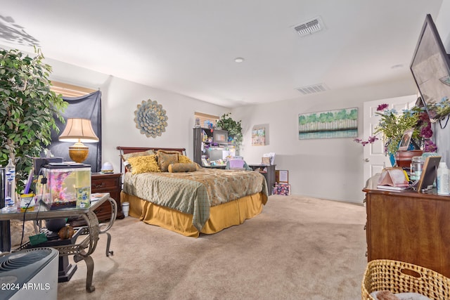 bedroom featuring light carpet