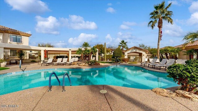 view of pool featuring a patio