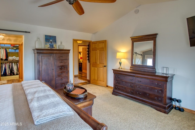 1420 S Haystack Rd, Taylor, AZ 85939 - bedroom featuring vaulted ceiling, a walk in closet, carpet, a closet, and a ceiling fan