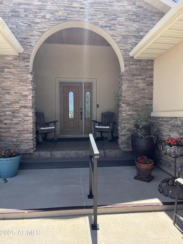 1420 S Haystack Rd, Taylor, AZ 85939 - doorway to property with stucco siding and stone siding