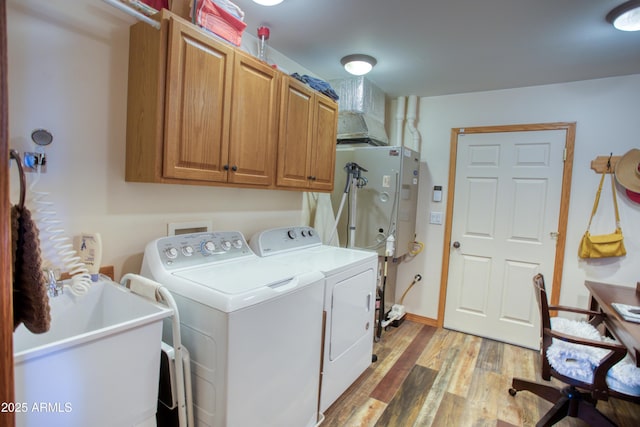 1420 S Haystack Rd, Taylor, AZ 85939 - washroom featuring washer and dryer, cabinet space, and light wood-style flooring