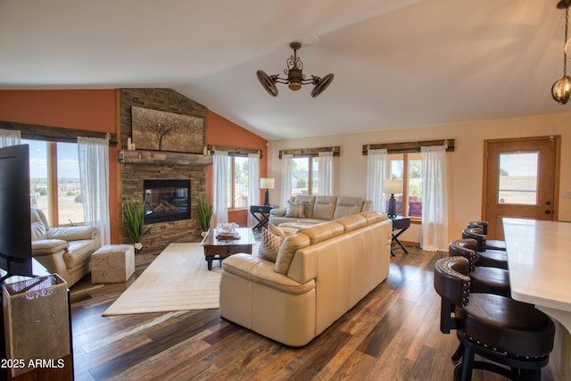 1420 S Haystack Rd, Taylor, AZ 85939 - living room featuring lofted ceiling, dark wood-style flooring, and a stone fireplace