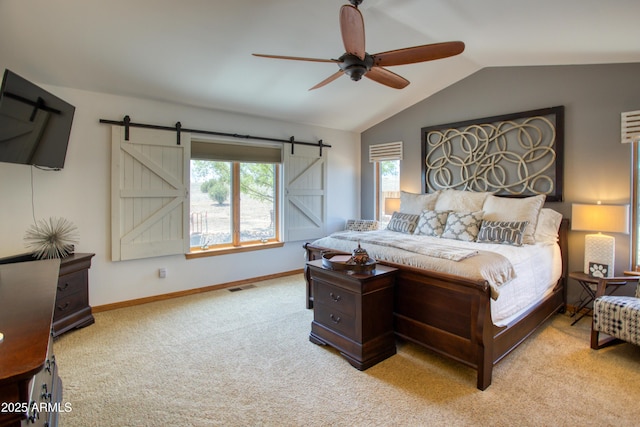 1420 S Haystack Rd, Taylor, AZ 85939 - bedroom with carpet, vaulted ceiling, a barn door, and ceiling fan