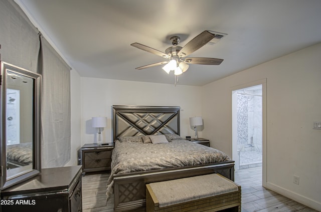 bedroom with a ceiling fan, ensuite bathroom, baseboards, and wood finished floors