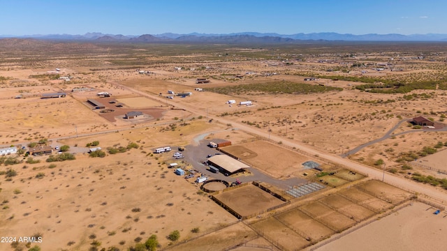 birds eye view of property featuring a mountain view