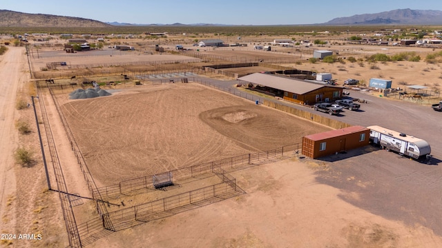 birds eye view of property with a mountain view and a rural view