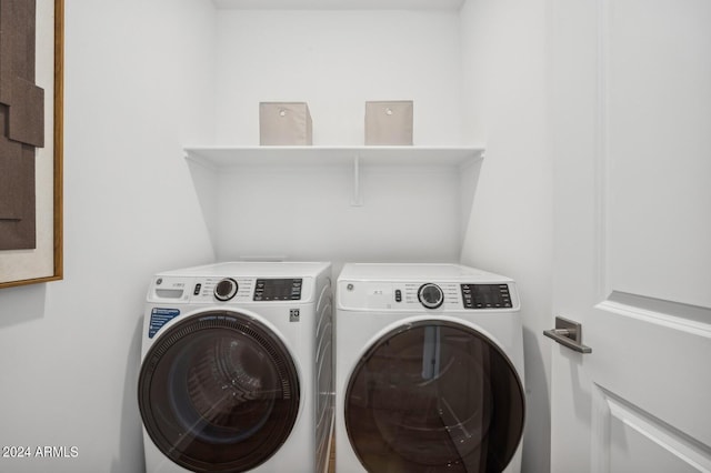 washroom featuring washing machine and dryer and laundry area