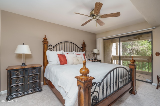 carpeted bedroom featuring access to outside, baseboards, and a ceiling fan