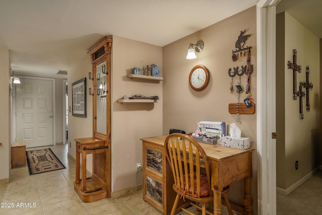 office featuring light tile patterned flooring and baseboards