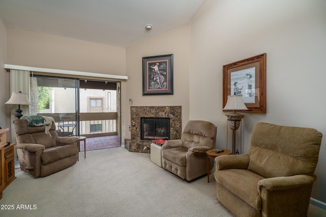 sitting room featuring carpet, high vaulted ceiling, and a high end fireplace