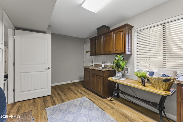 office area featuring dark hardwood / wood-style floors and sink