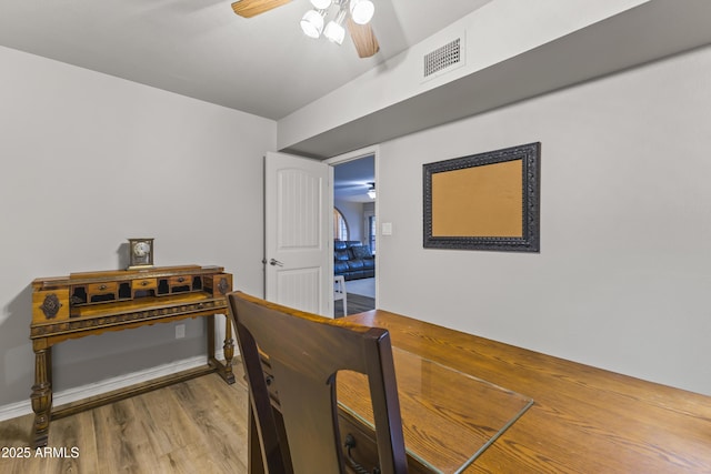 interior space with hardwood / wood-style flooring and ceiling fan