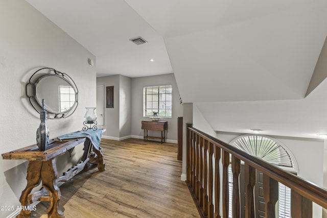 hall with light wood-type flooring