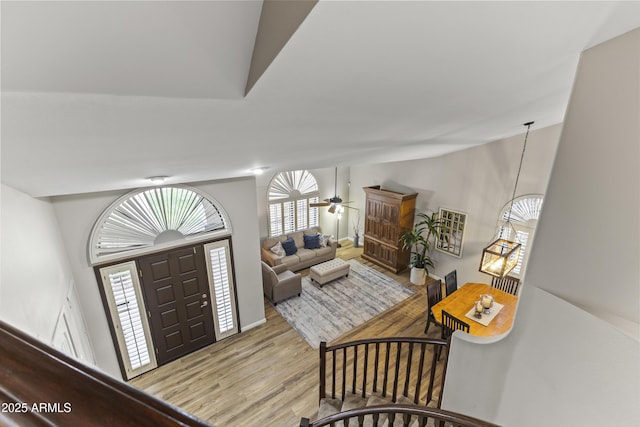 foyer with light hardwood / wood-style floors and ceiling fan