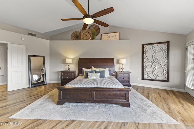 bedroom with vaulted ceiling, light wood-type flooring, and ceiling fan